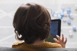 back-view-kid-holding-tablet-1